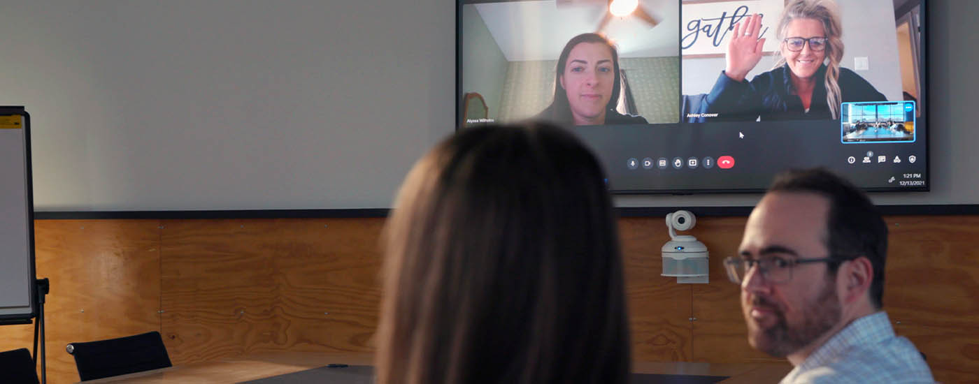 ConferenceShot in a hybrid video conferencing room.