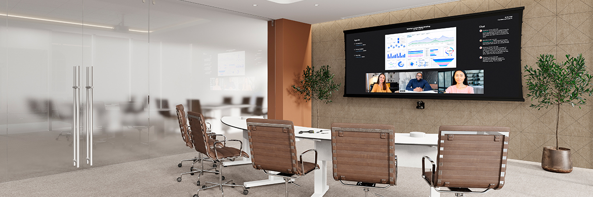Da-Lite ultrawide projection screen used for video conferencing in a boardroom.